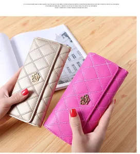 Detail of champagne and rose pink quilted PU leather wallets with gold crown accents