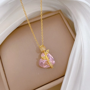 Pink heart crystal necklace with golden rose detail and sparkling diamonds on silk