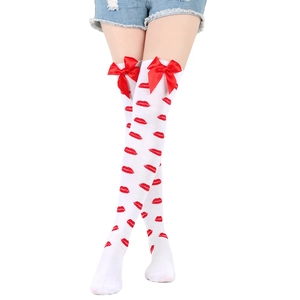 Detailed view of white over-knee socks with red lip prints and decorative bows