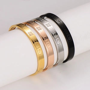 Set of four stainless steel Greek key bracelets with rhinestones in gold and silver