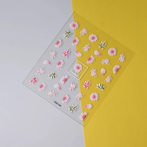 Detail of pink cherry blossom nail stickers with green leaves and Beautiful text