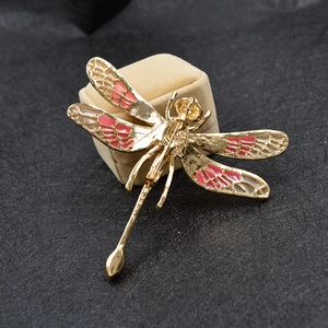 Exquisite large dragonfly brooch in gold and red enamel with intricate hollowed textures