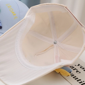 Detail of a kids baseball cap featuring reinforced seams and high-quality inner stitching