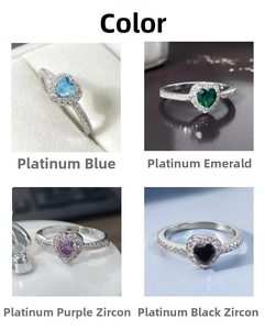 Detail view of heart-shaped rings in aquamarine, emerald, purple, and black zircon