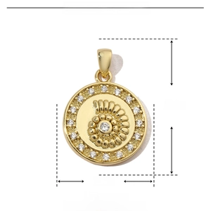 Macro view of gold spiral seashell pendant with zircon, 16x23mm copper jewelry piece
