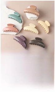 Detailed view of crescent moon hair claws in various colors and PC material specifications