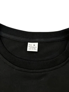 Detail of crew neck collar with size M label showing 95% polyester fabric composition
