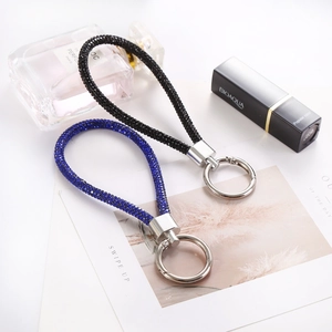 Detail of sparkling rhinestone keychain lanyards in black and blue with silver clasps