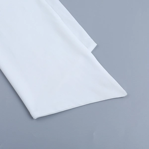 Detail shot of premium white fabric texture on the elegant slit shoulder maxi dress