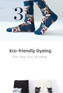 Detail of ribbed cuffs on cotton crew socks with blue dog and black cat patterns