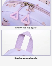 Detail of smooth two-way zippers and durable webbing handle on kids purple backpack