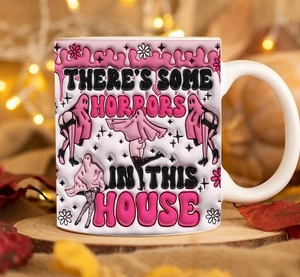 Close-up of a 3D Halloween ghost coffee mug with pink handle in a festive setting