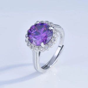 Macro shot of 5 carat round purple gemstone ring with halo and beaded silver band