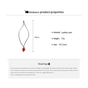 Detail showing 74cm brown leather cord and 2.8cm red resin strawberry pendant necklace