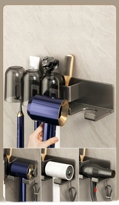 Wall-mounted dark grey bathroom organizer with hair dryer holder and three tumbler slots