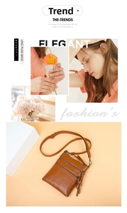 Close-up of brown crossbody bag with three zipper layers and elegant tassel details