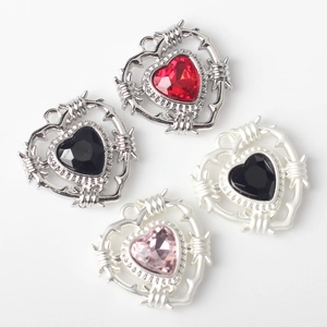 Hollow heart pendants with zirconia inlay and thorn design in silver and white alloy