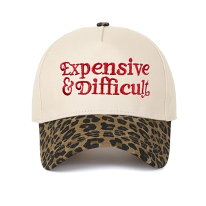Close-up of red Expensive & Difficult embroidery on leopard print brim baseball cap