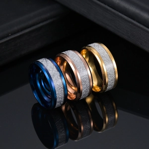 Titanium steel rings in blue, rose gold, and gold featuring unique meteorite inlay texture