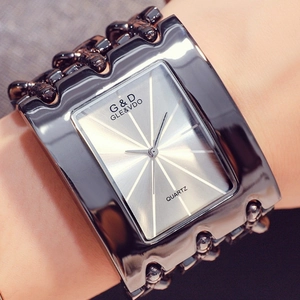 Detailed close-up of a silver chain strap women's watch with rectangular quartz dial
