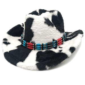 Detail of plush cow print cowboy hat featuring a bohemian colorful beaded band trim