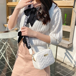 White quilted PU leather crossbody bag with wide printed strap and gold hardware accents
