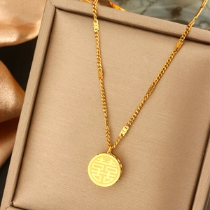 Close-up of gold pearl necklace with Double Happiness pendant in a luxury jewelry box