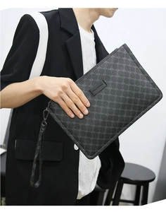 Stylish men's clutch bag with geometric pattern and wrist strap for daily business casual use.