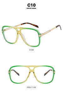 Detail of square pilot sunglasses with gradient green frames and golden metal temples