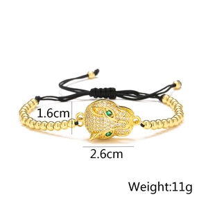 Macro detail of 18K gold plated leopard head charm with dimensions and 11g weight