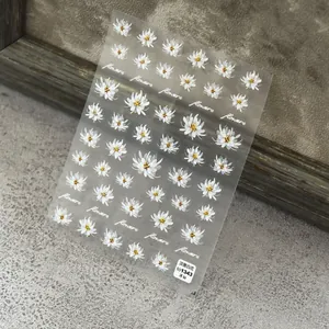 Macro shot of ultra-thin white floral nail art stickers to1343 with daisy patterns