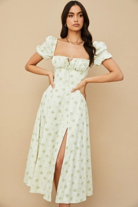 Close-up of puff sleeves and square neck tie on a floral print light green maxi dress