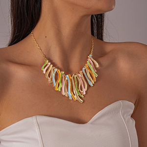 Colorful enamel geometric fringe necklace shown on model with vibrant macaron pendants