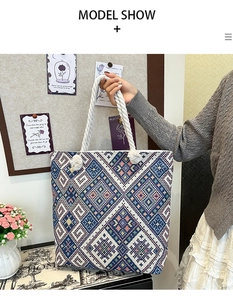 Close-up of bohemian canvas tote bag featuring geometric embroidery and rope handles