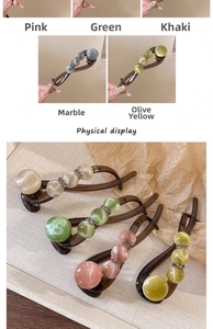 Detail of resin banana clips with acrylic rhinestones and cat eye beads in five colors