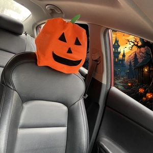 Halloween pumpkin face car headrest cover in orange felt fabric for festive car interior
