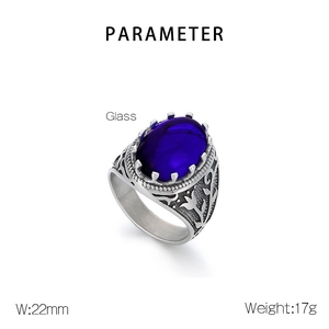 Macro detail of vintage men's ring with purple gemstone and floral engraving on band