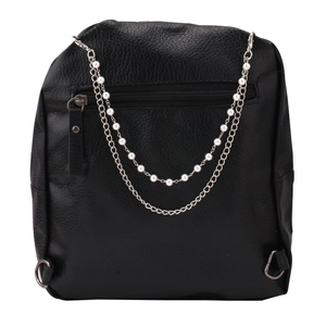 Detail of black pebbled leather backpack featuring pearl and silver metal chain accents