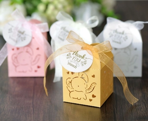 Detail of hollow elephant candy boxes with sheer ribbons and Thank You tags