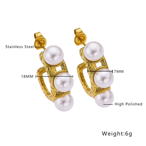 Detail of 18mm high polished gold stainless steel earrings with 7mm white pearls