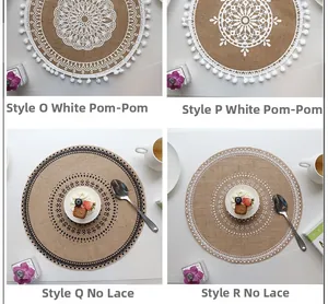 Detail of round jute placemats with mandala patterns and tassel fringe decorations