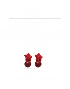 Detailed view of red polka dot star earrings with dark red faux pearls and 4.2cm size
