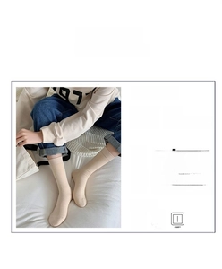 Detail of beige ribbed cotton socks showing breathable texture and soft elastic fabric