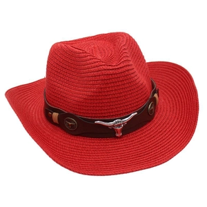 Detail of red straw cowboy hat with brown leather band and silver bull head ornament
