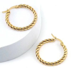 Detailed view of two 18K gold-plated twisted hoop earrings with premium metallic texture