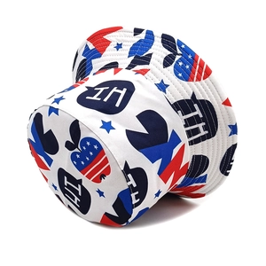 Detail view of cotton bucket hat featuring American style stars and apple graphic prints