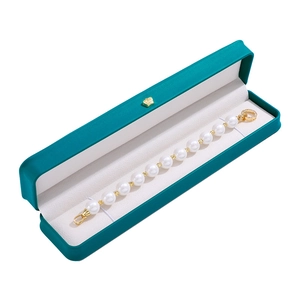 Elegant white pearl bracelet with gold spacers in premium cyan crown jewelry gift box