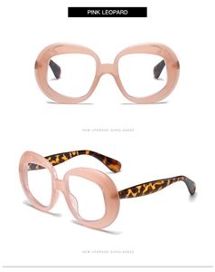 Detailed view of oversized pink leopard frames with high-quality transparent finishes