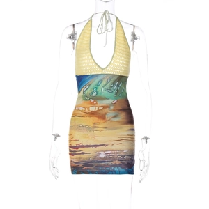 Detail view of yellow crochet knit top and landscape print on bodycon mini dress
