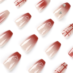 Red gradient coffin press-on nails with hollow heart pattern, plaid design and rhinestones